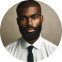 A man with a beard wearing a white shirt and tie.