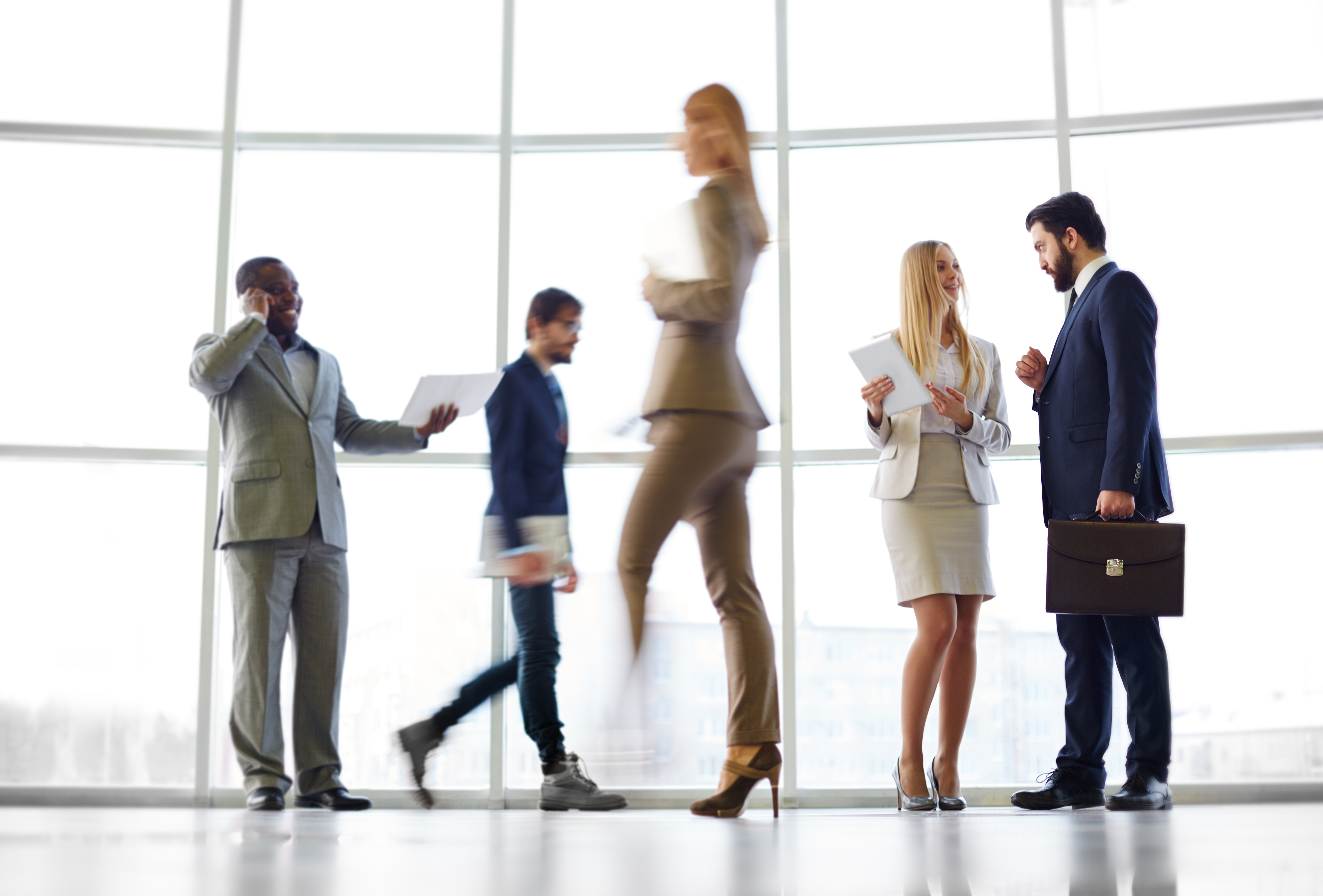 Busy corporate office environment representing modern corporate life and fast-paced work culture