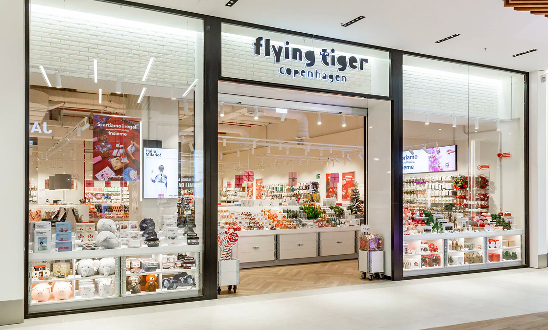 Exterior view of a Flying Tiger Copenhagen store displaying various colorful products and holiday decorations.