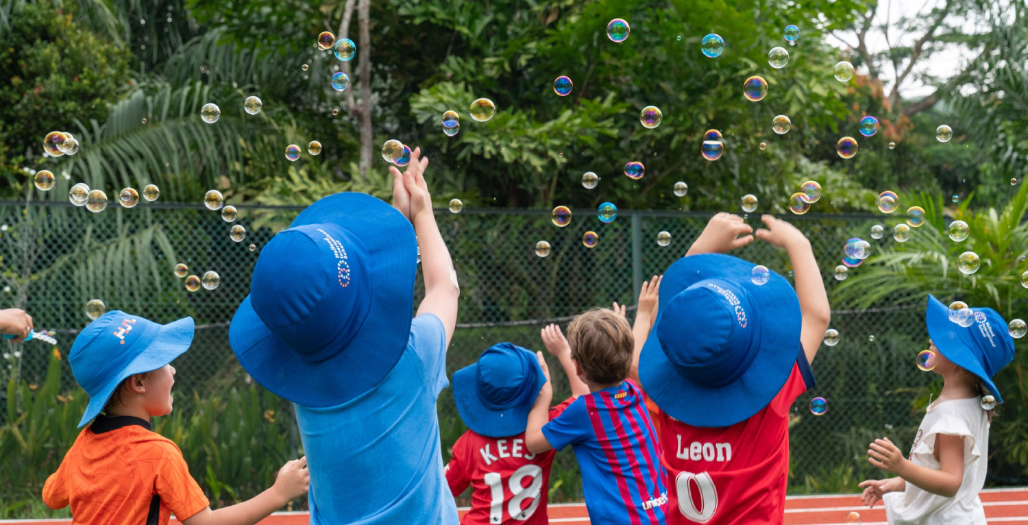 international primary school kids playing
