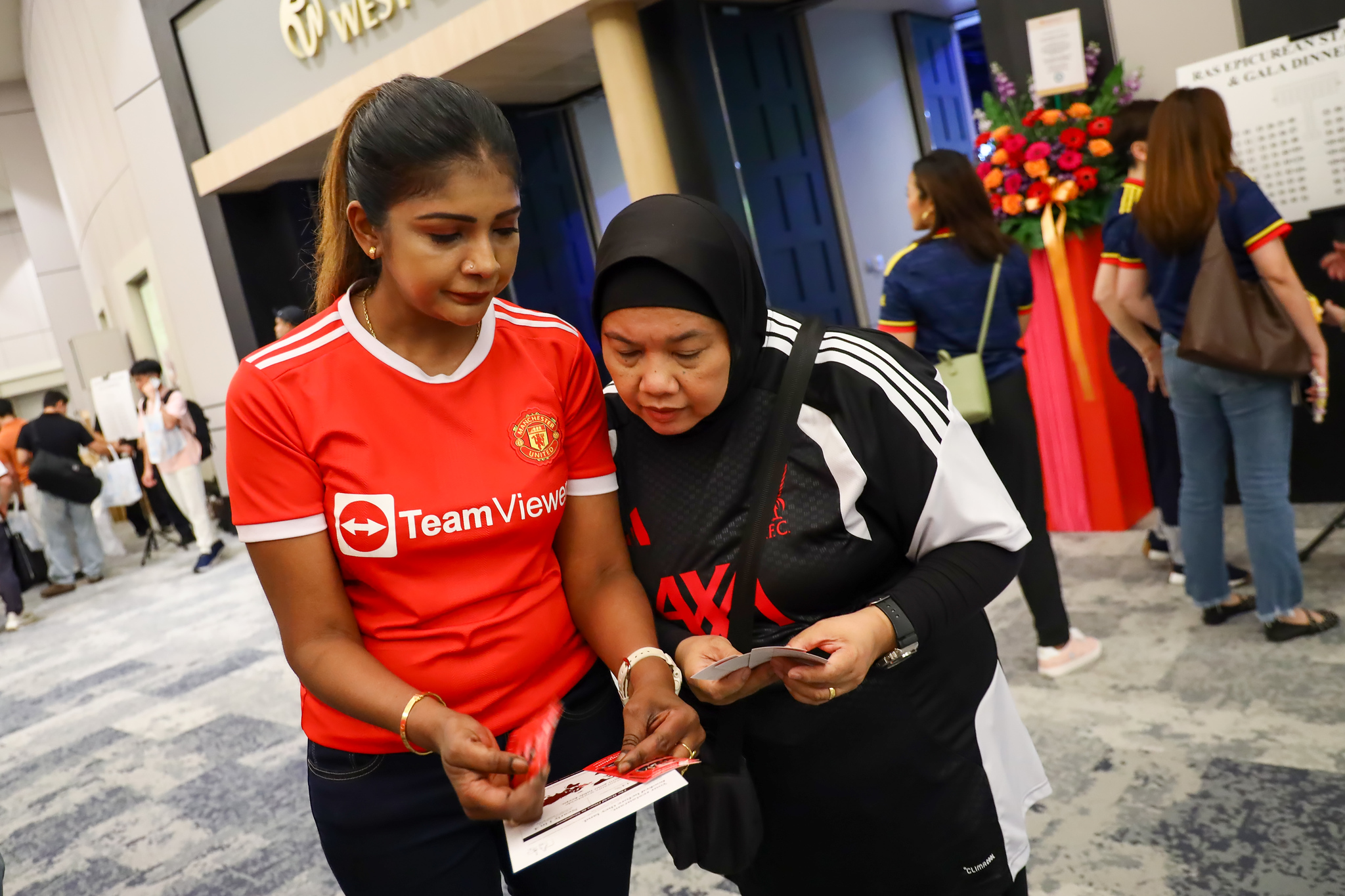 Guests in football jerseys arrive for the night