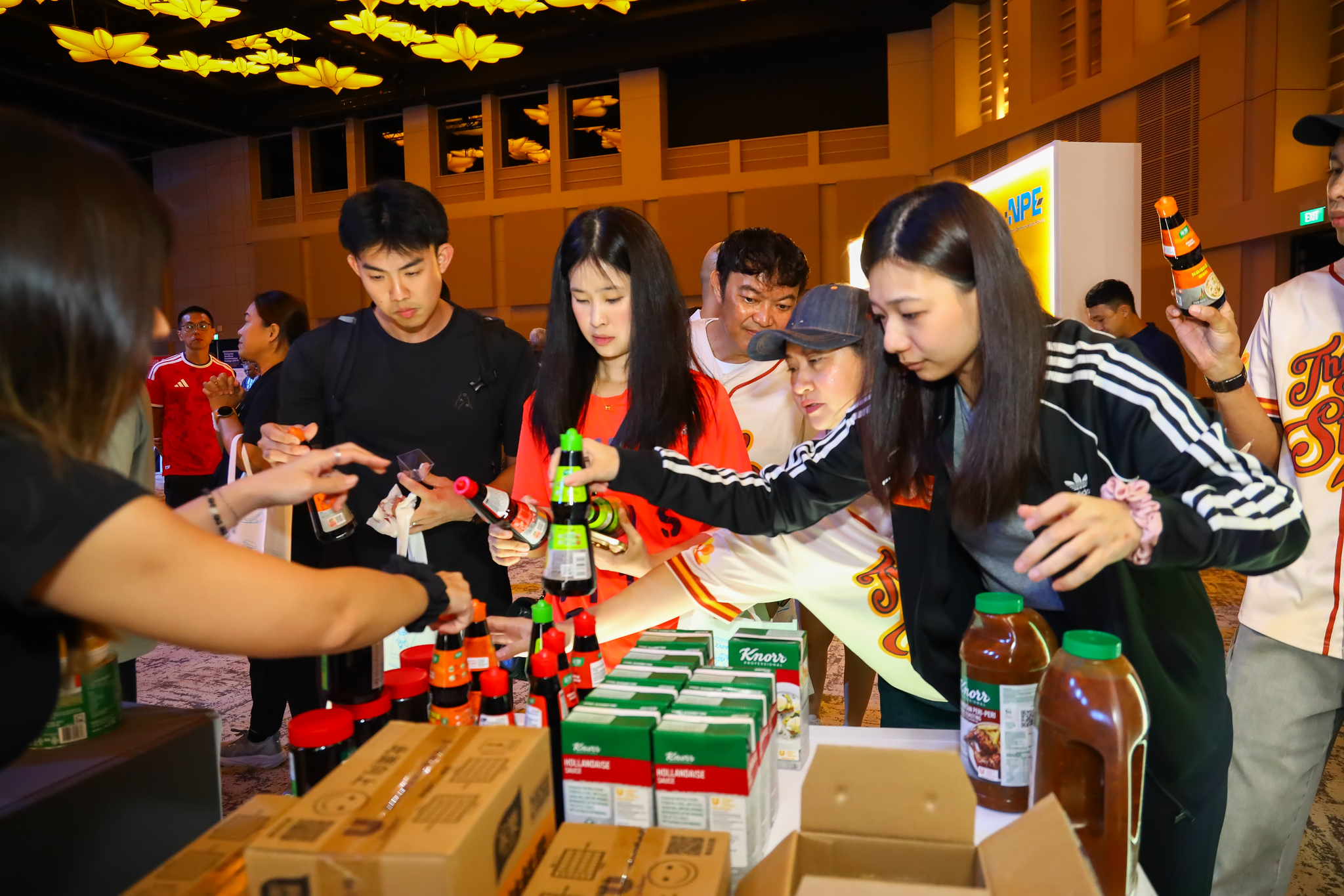 Guests trying sauces at an ingredients partner booth