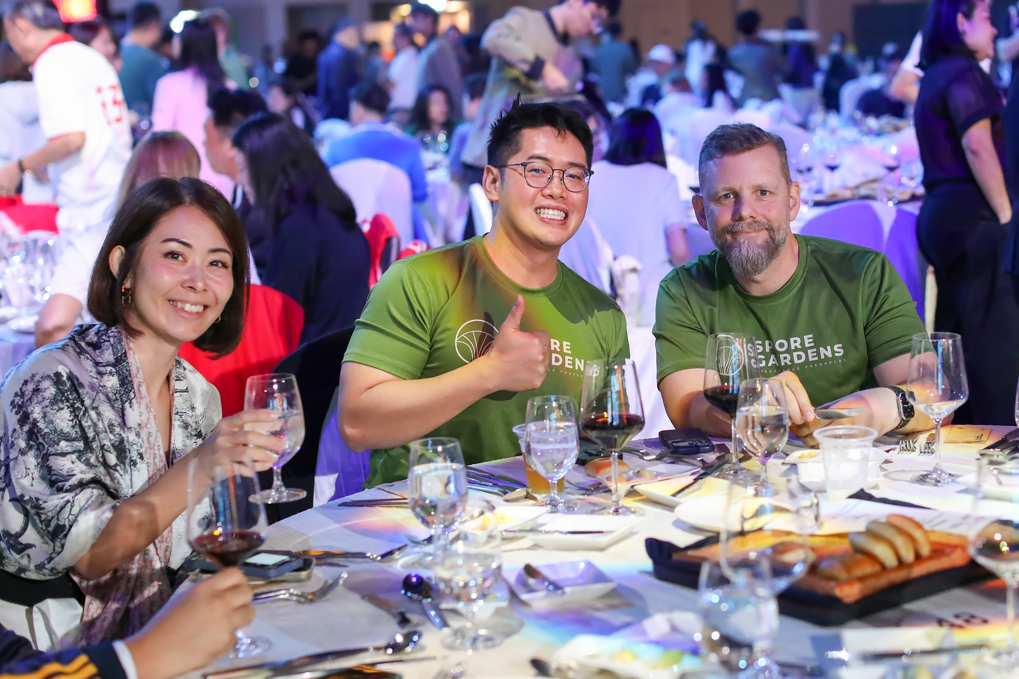 Thumbs up from a table of guests