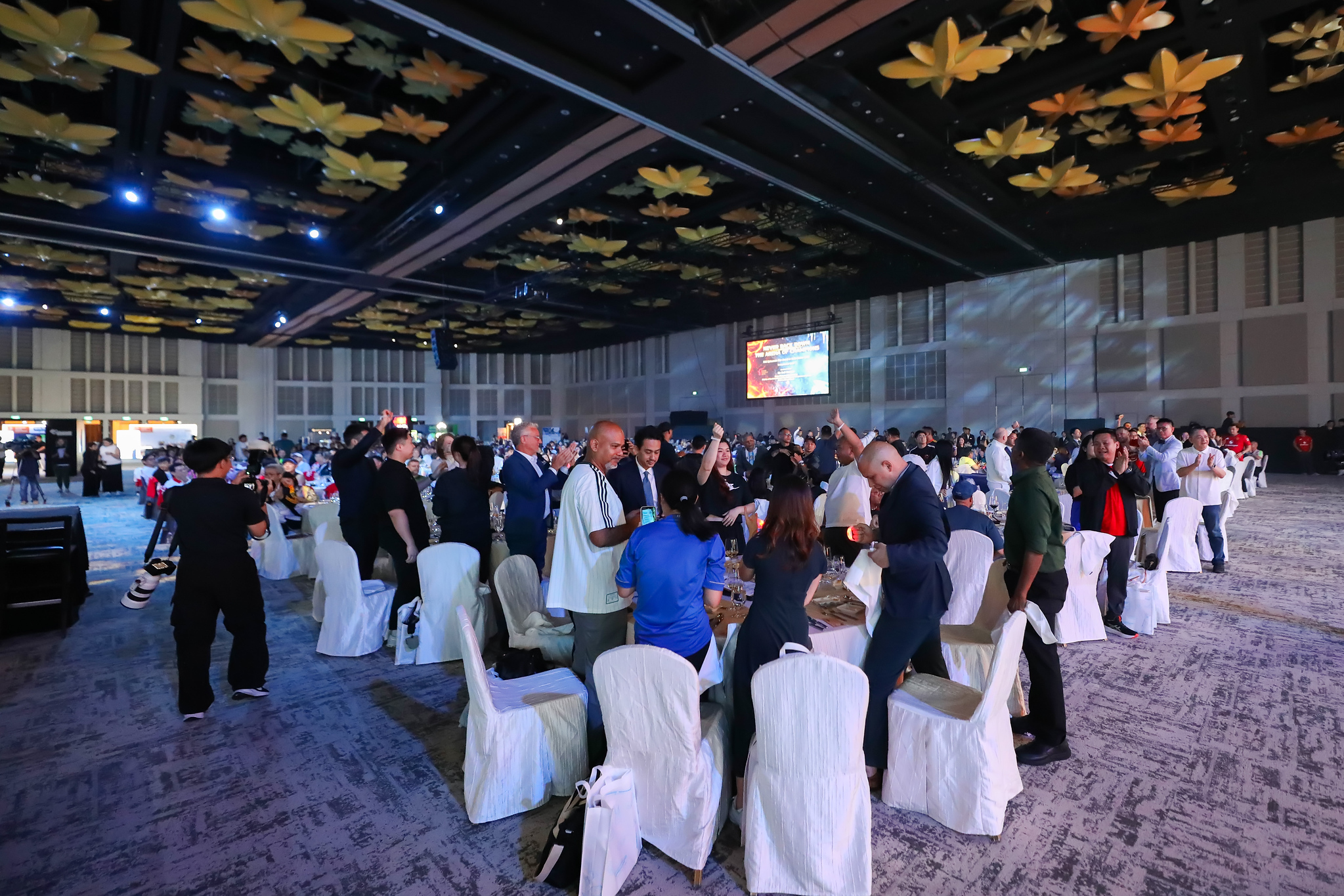 Guests on their feet in the ballroom at Epicurean 2026