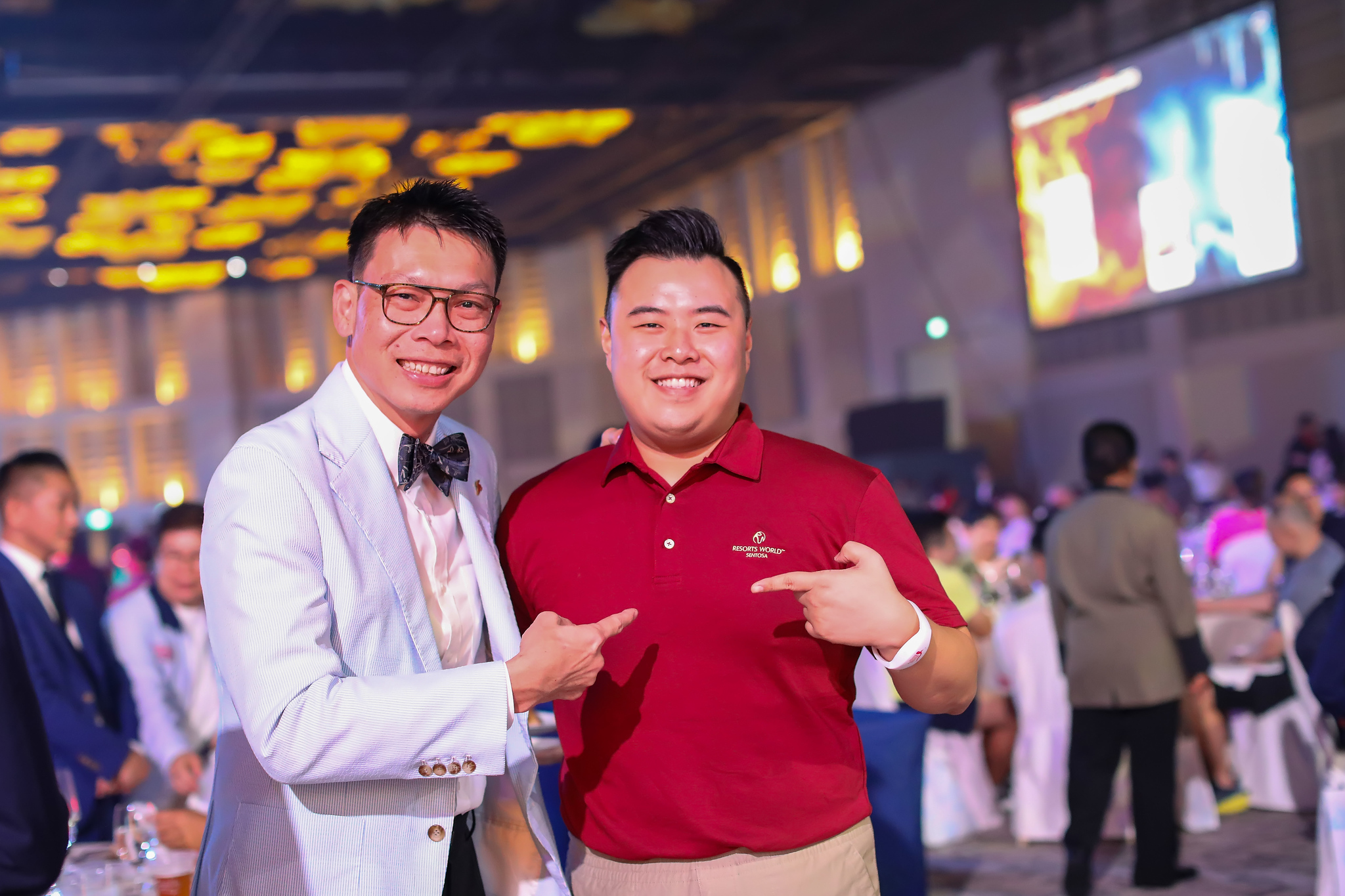 Two guests share a laugh at the gala