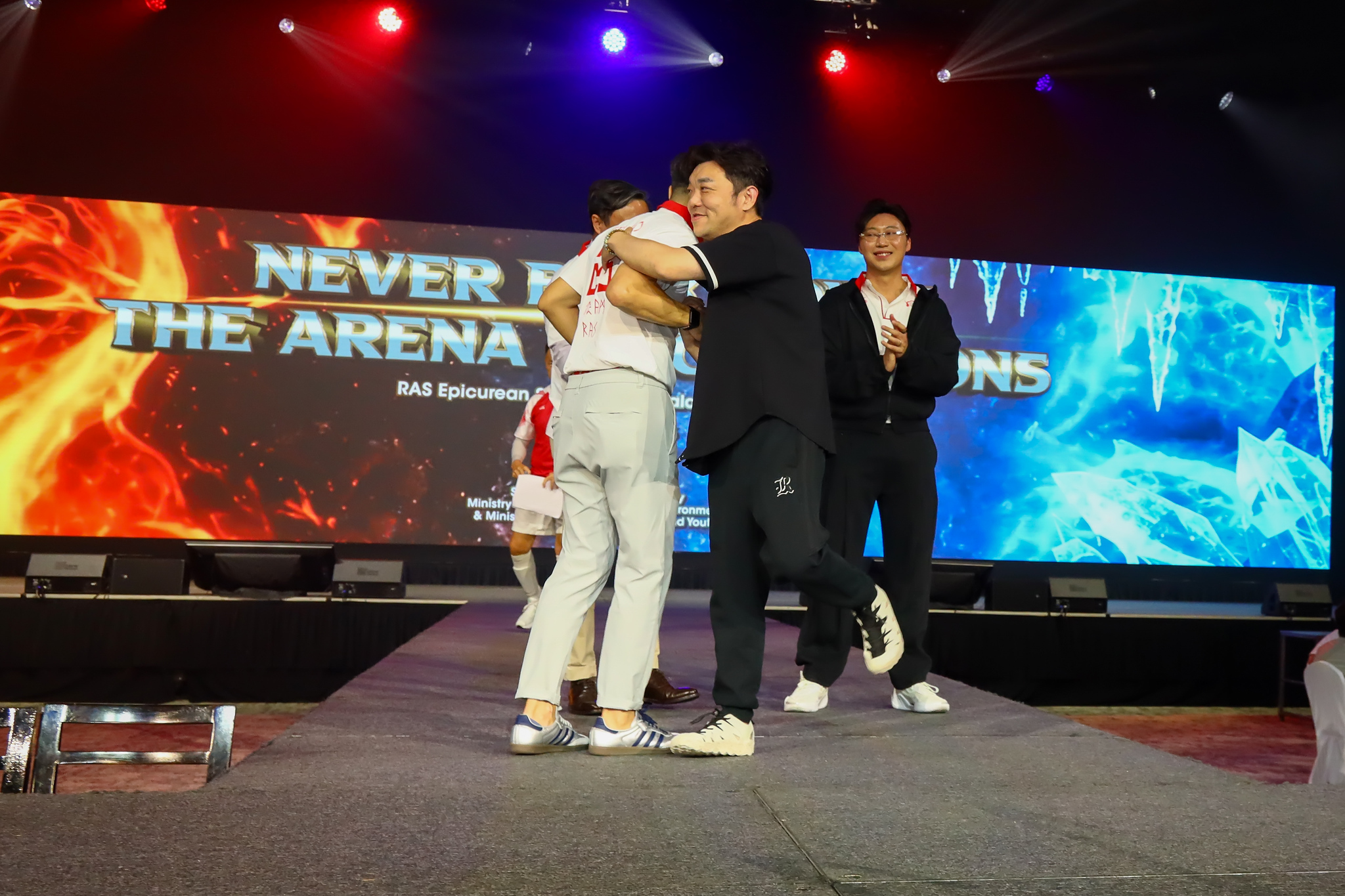 A big hug on stage