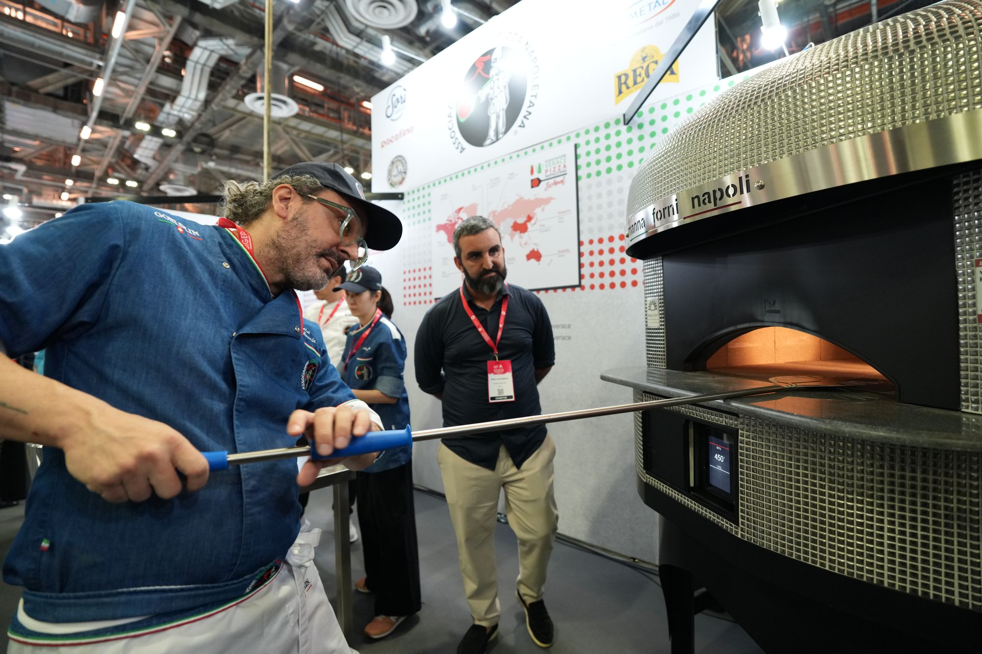 A pizza oven demonstration on the show floor