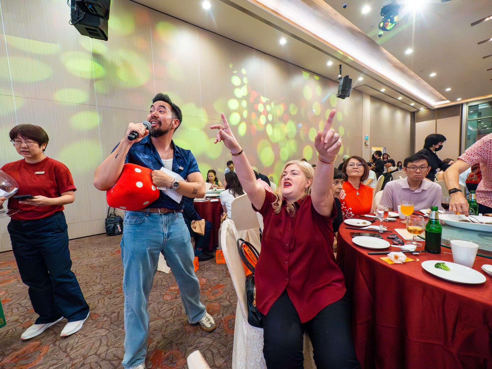 The host gets the room cheering during the games