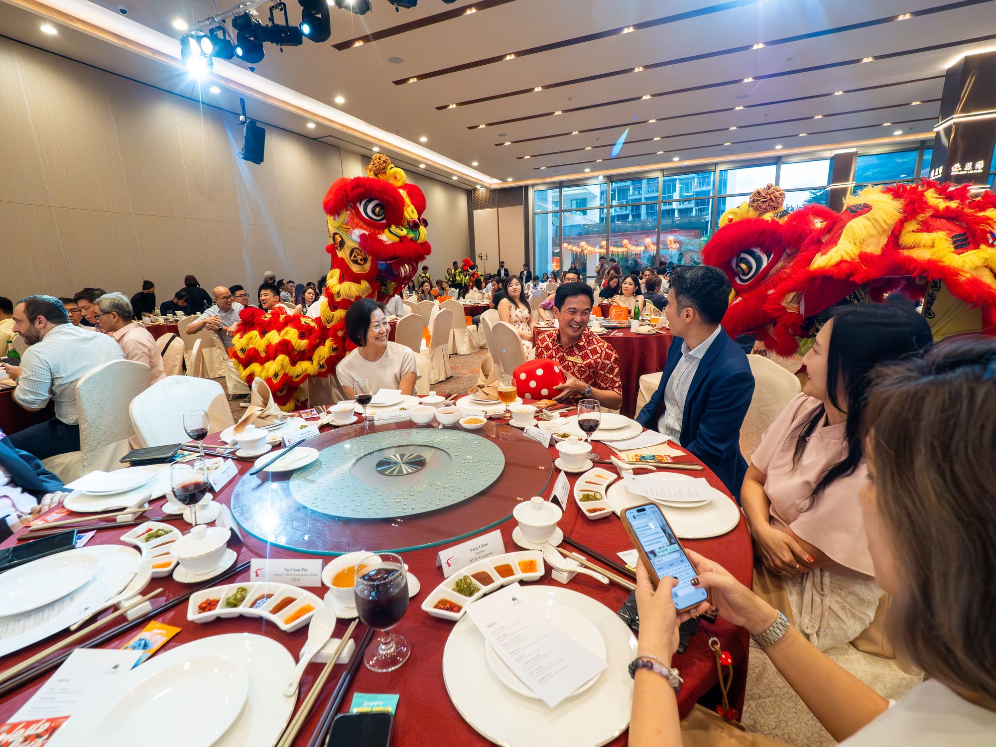 Lion dancers perform among the dinner tables