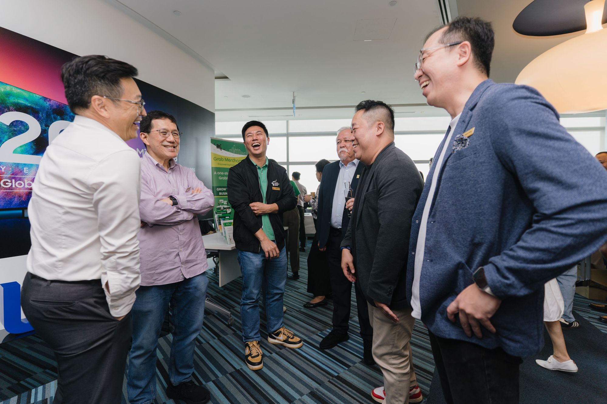 Members share a laugh before the meeting begins