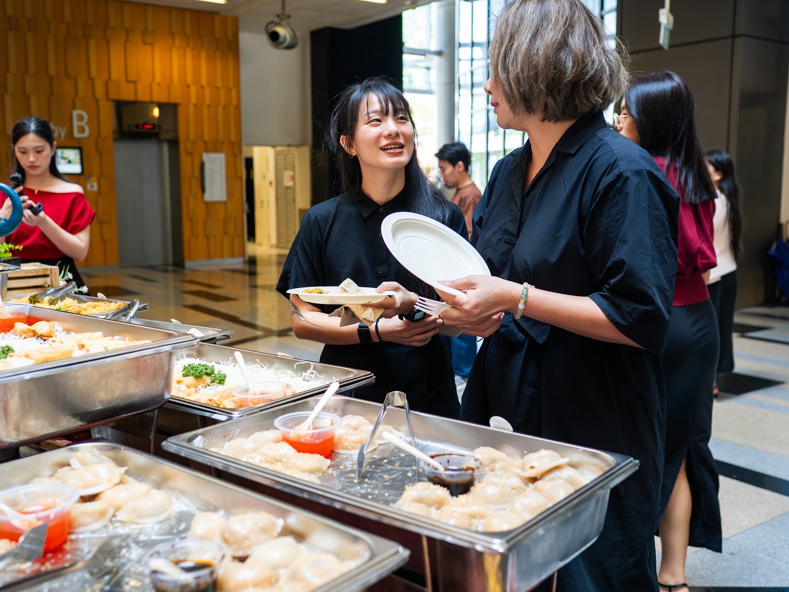 Guests helping themselves to food after the masterclass