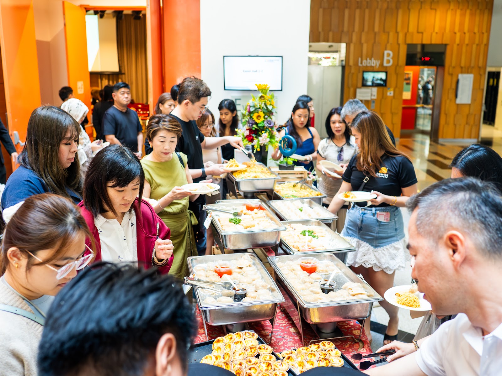 Attendees networking over food after the session