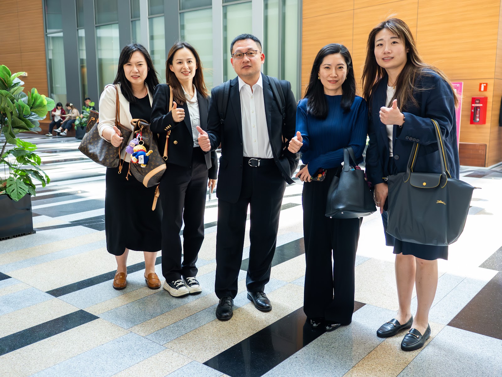 Guests posing for a group photo in the foyer
