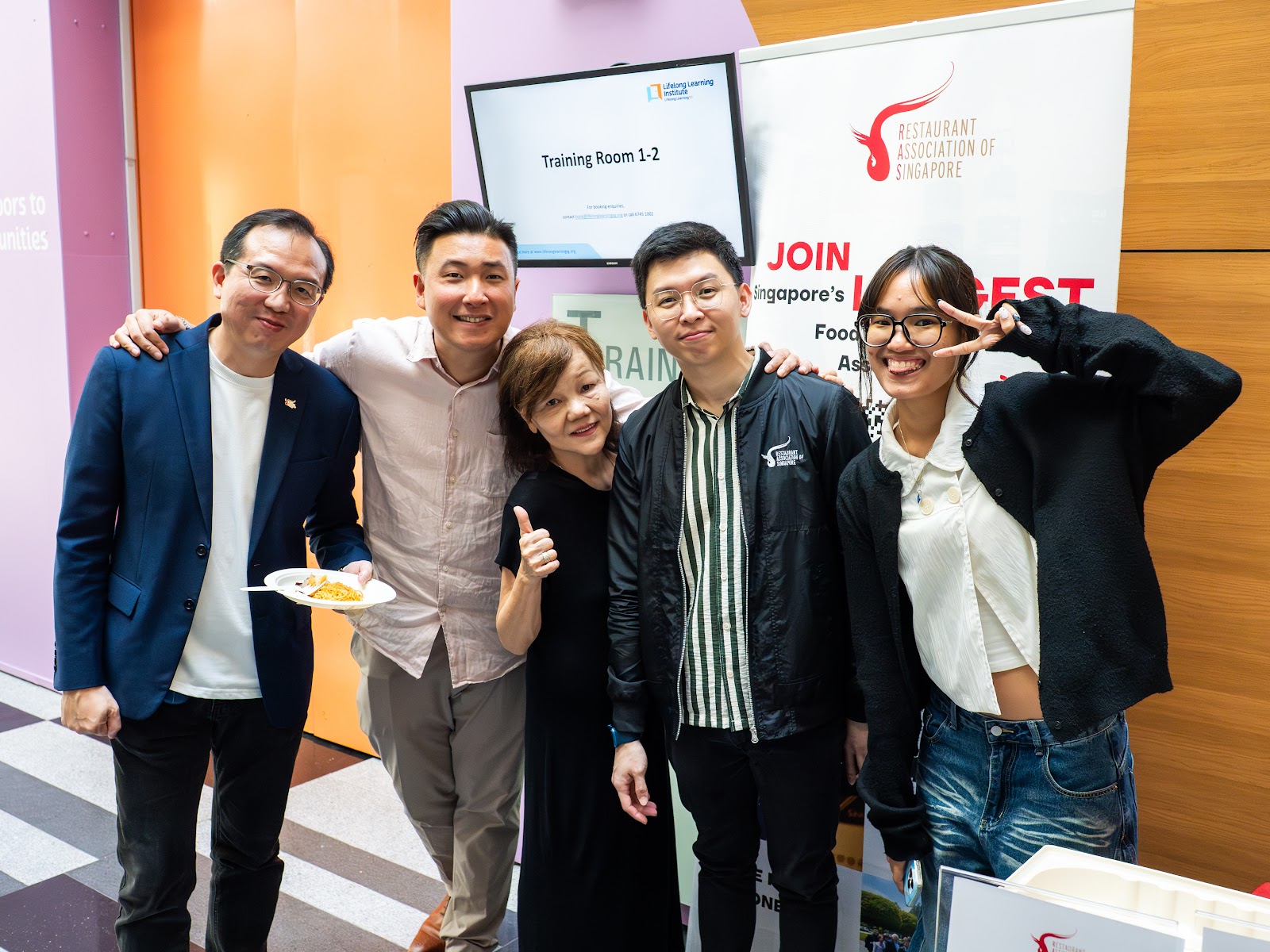Attendees posing for a photo after the masterclass
