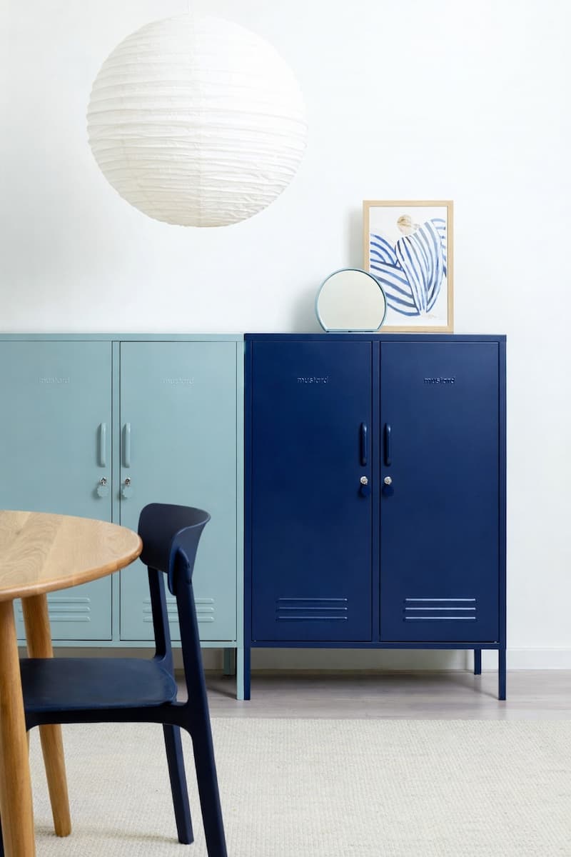 Legged metal storage cabinet suitable for multi-family residential projects requiring consistent cabinet structures