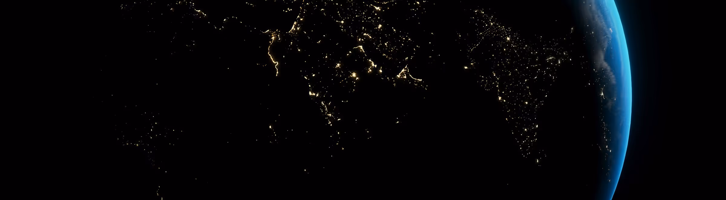 Nighttime view of Earth from space showing illuminated city lights across parts of Europe, the Middle East, and northern Africa.