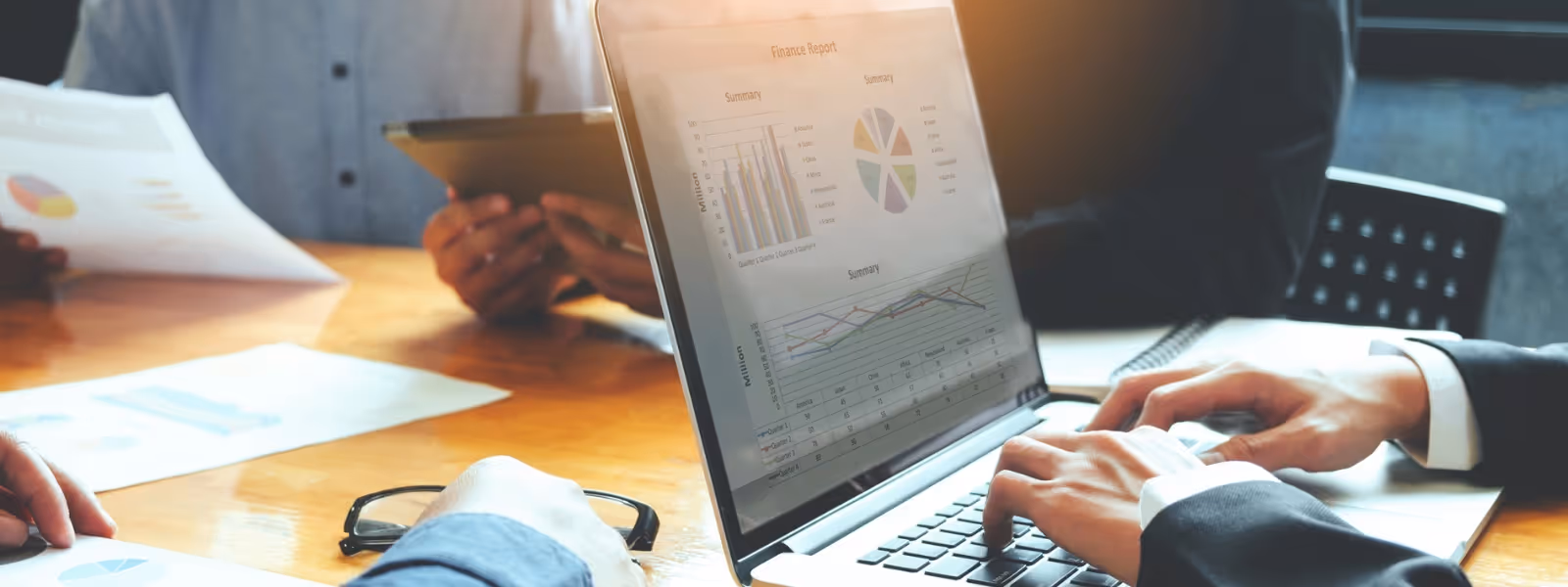 Cross-functional team reviewing a financial dashboard