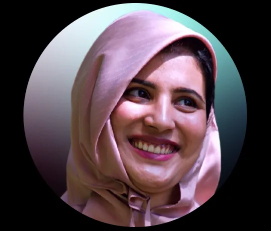 Smiling woman wearing a light pink hijab against a gradient background.