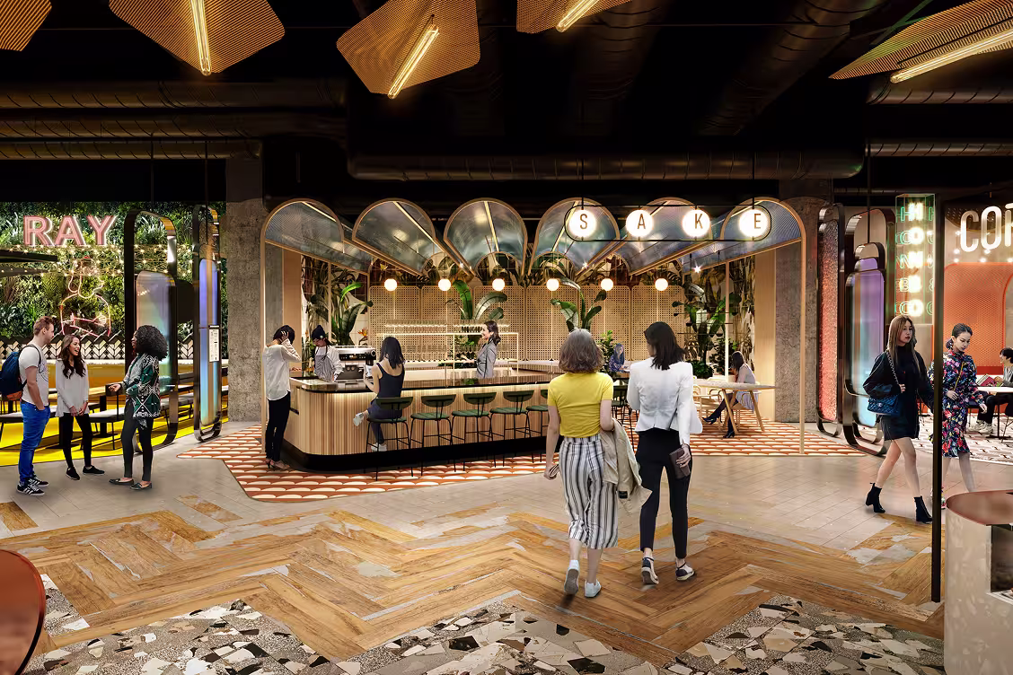 Indoor modern food hall with a central sake bar, people walking and talking, and decorative lighting and greenery.