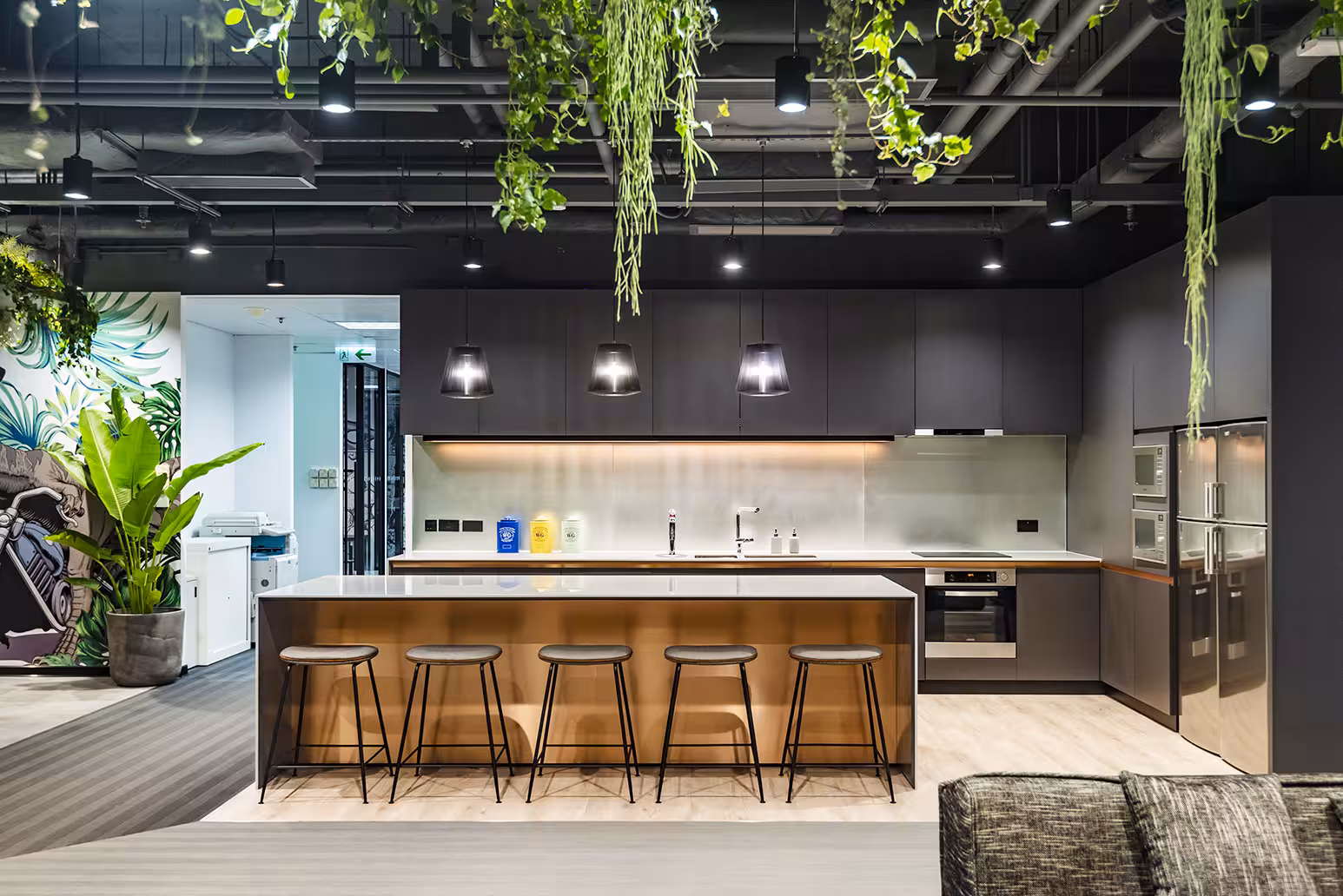 ThreeSixty Group office ceiling and services design showing exposed industrial elements and pendant lighting