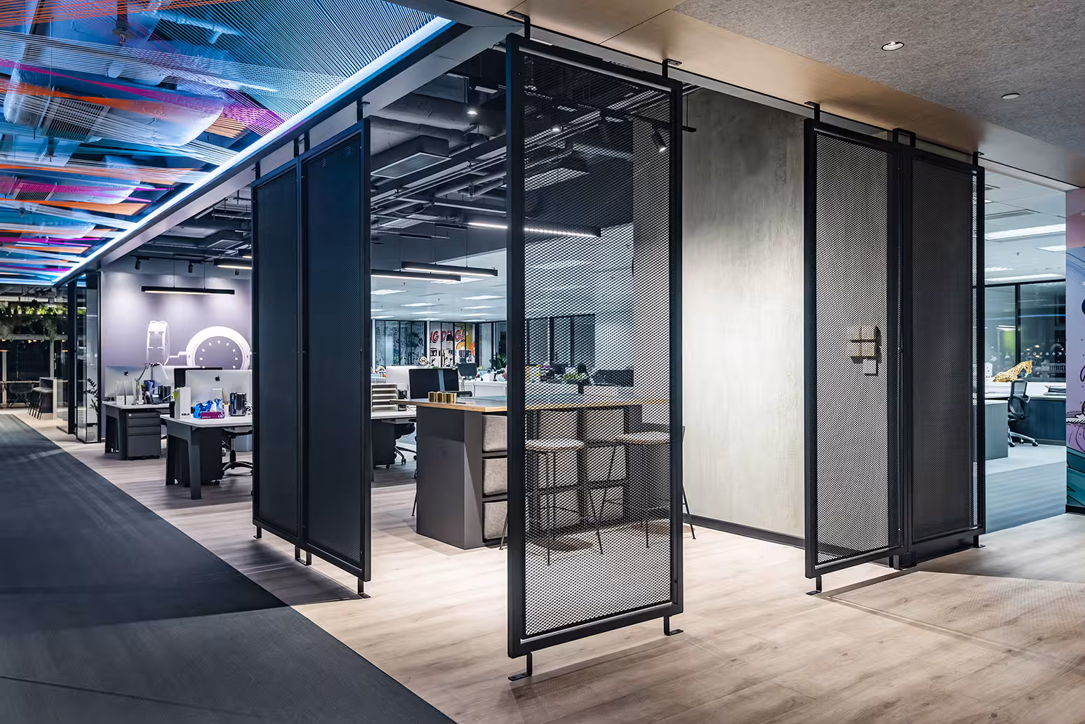 ThreeSixty Group office corridor and circulation showing raw concrete columns, timber panelling, and spatial transitions