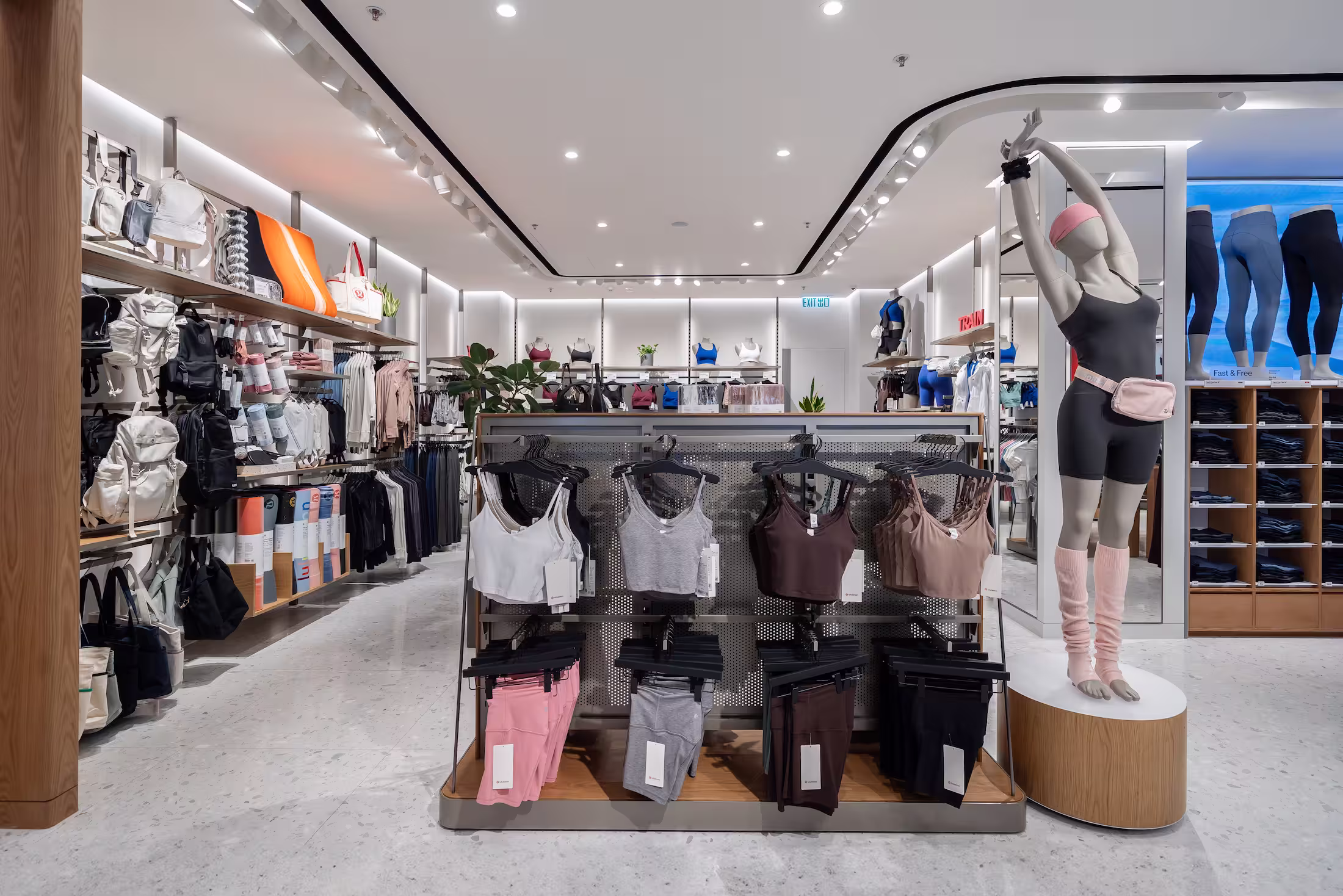 lululemon Pacific Place flagship service counter and cash wrap with integrated product display.