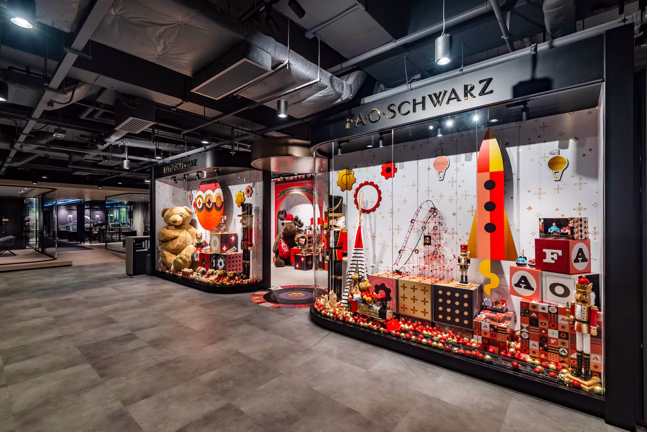 FAO Schwarz Hong Kong store product display zone with experiential merchandising and interactive retail elements