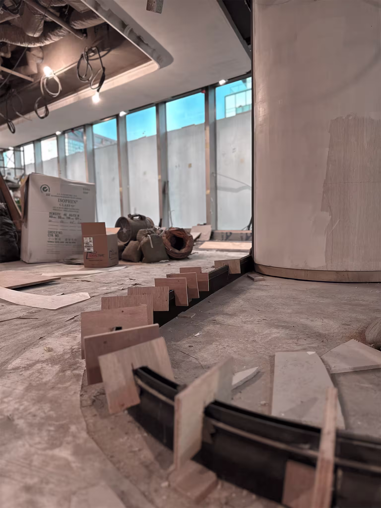 Construction progress photograph of LFCH headquarters showing boardroom pod framing and structural column concealment works