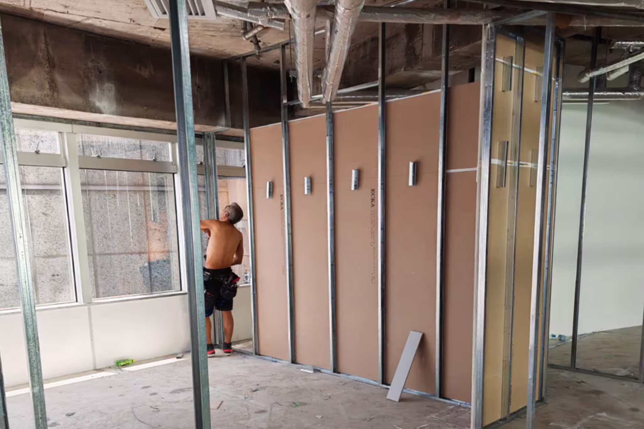 Construction progress photograph of Assembly Global office showing demolition and site preparation works in Sheung Wan