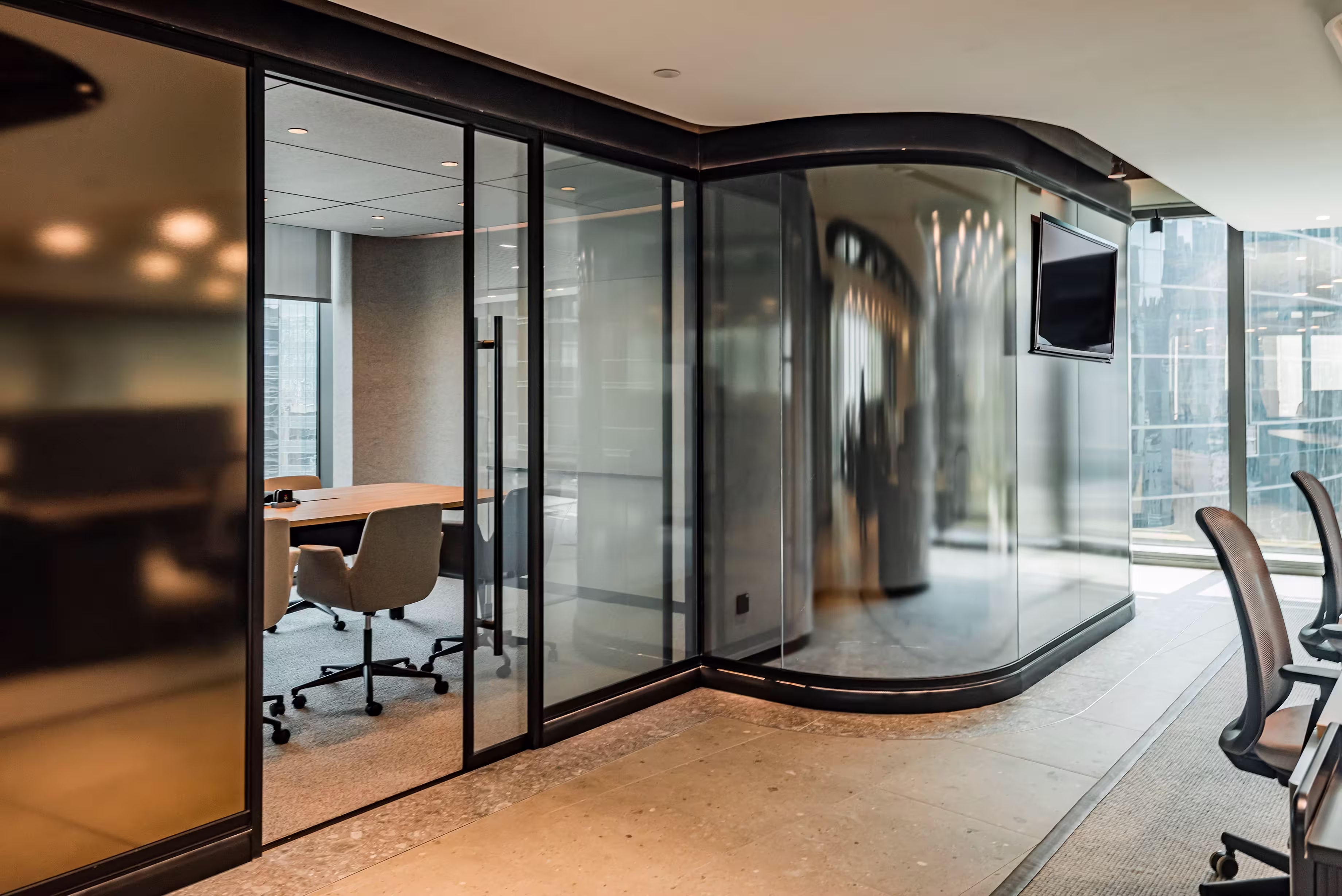 LFCH headquarters panoramic boardroom pod in Sheung Wan Hong Kong concealing structural columns with uninterrupted city skyline views