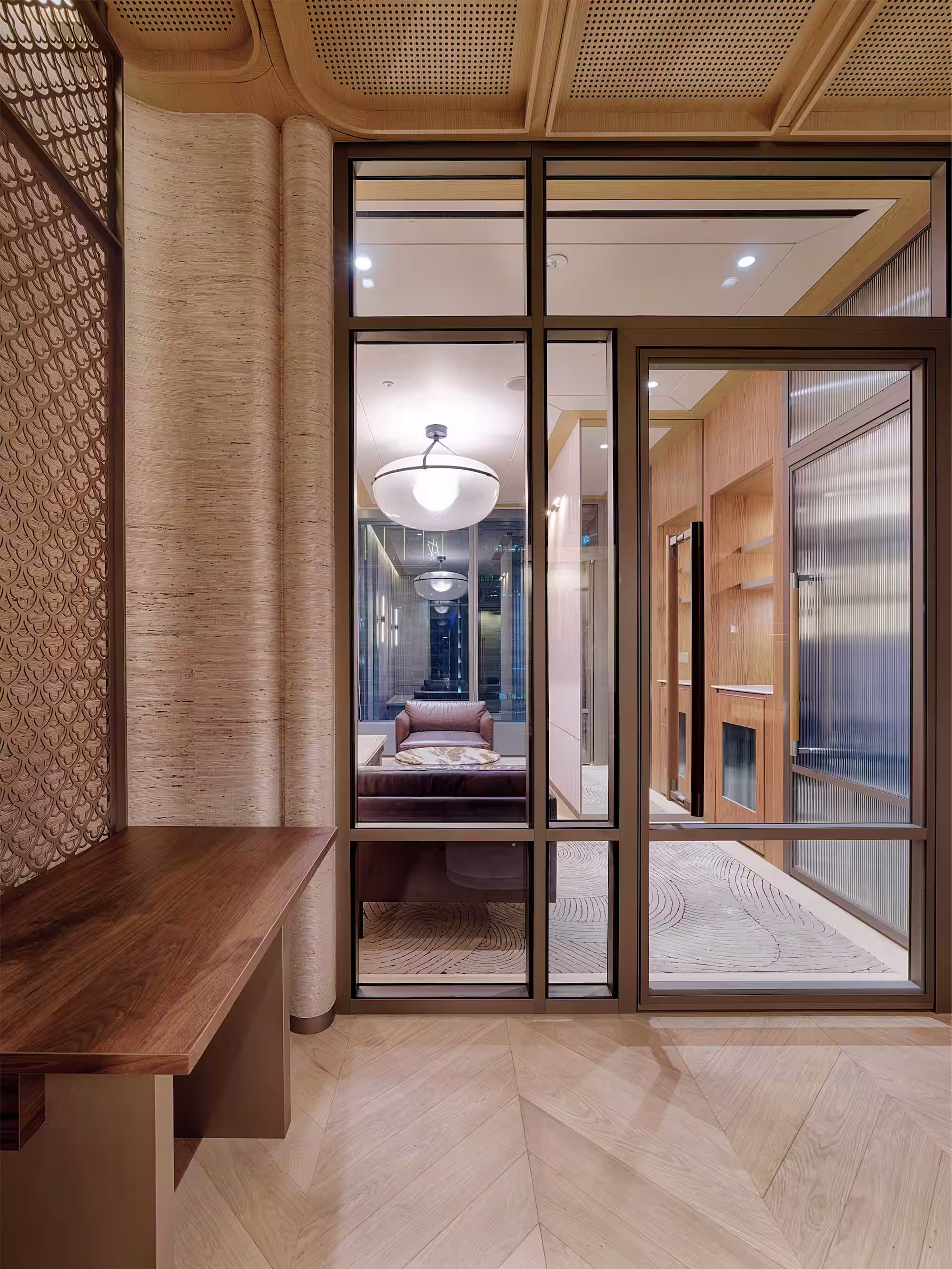 Silvercrest Singapore office wide interior showing the open workspace with harbour views and contemporary material palette