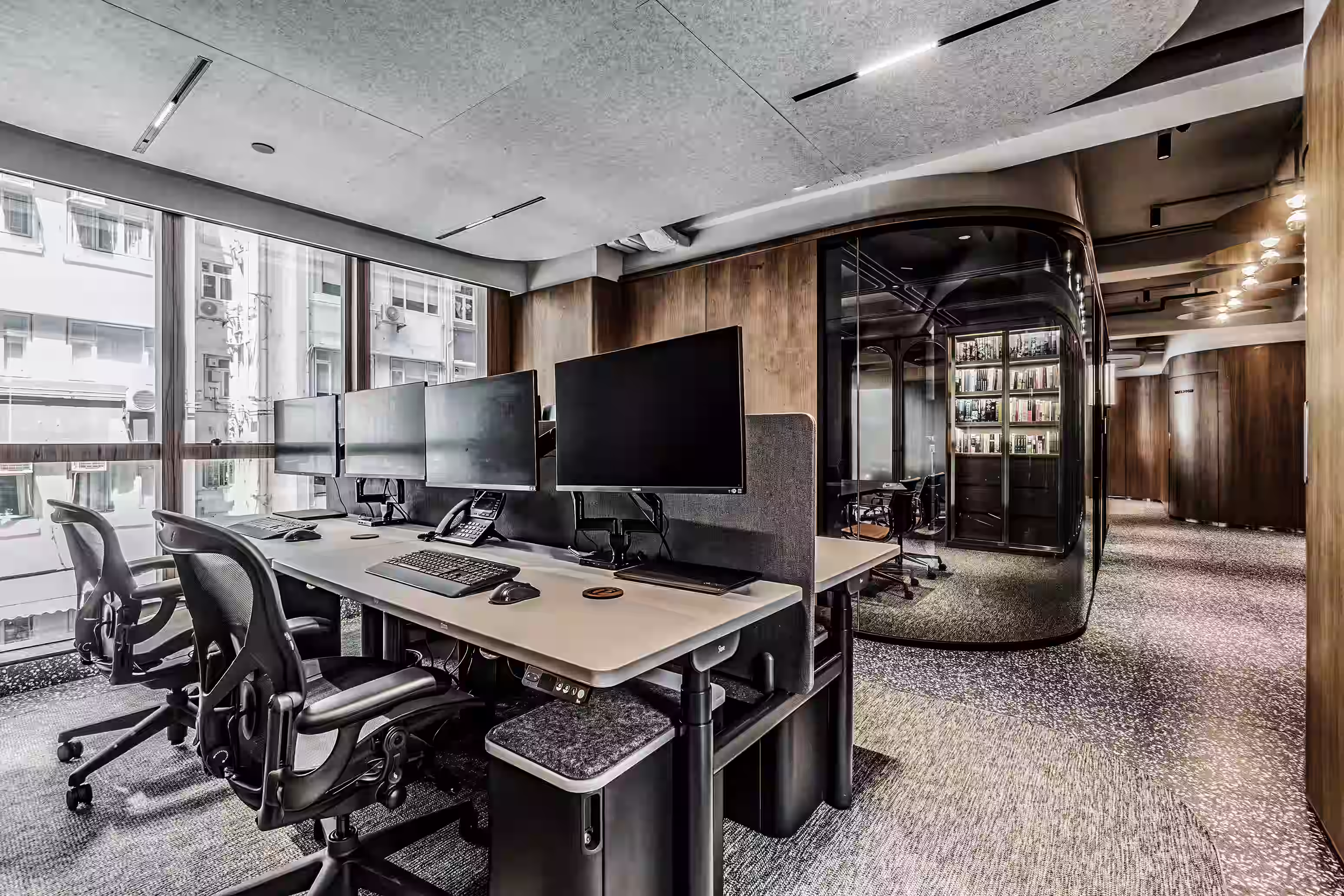 Private Capital office window view in Central Hong Kong showing the harbour panorama from the executive workspace