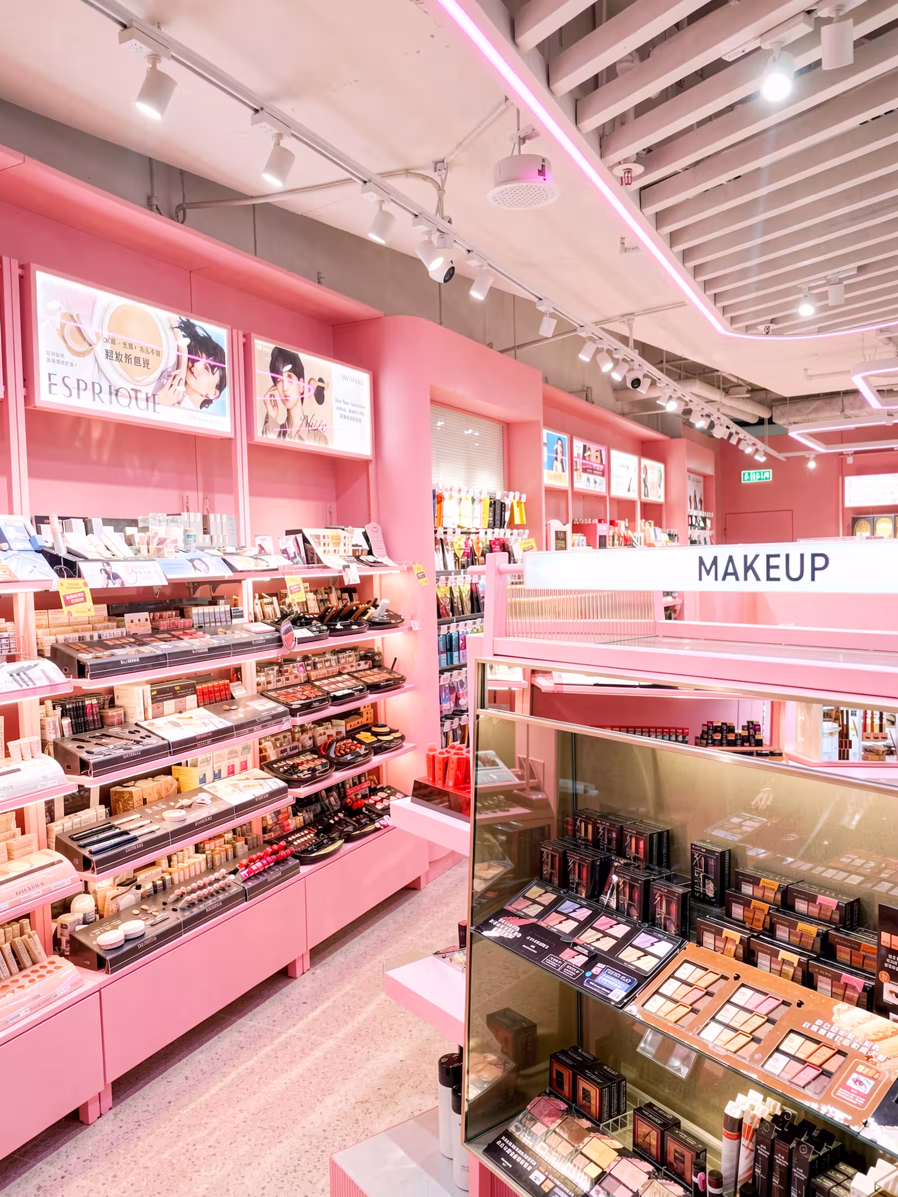 Tokyo Lifestyle concession makeup section with pink shelving and illuminated signage.