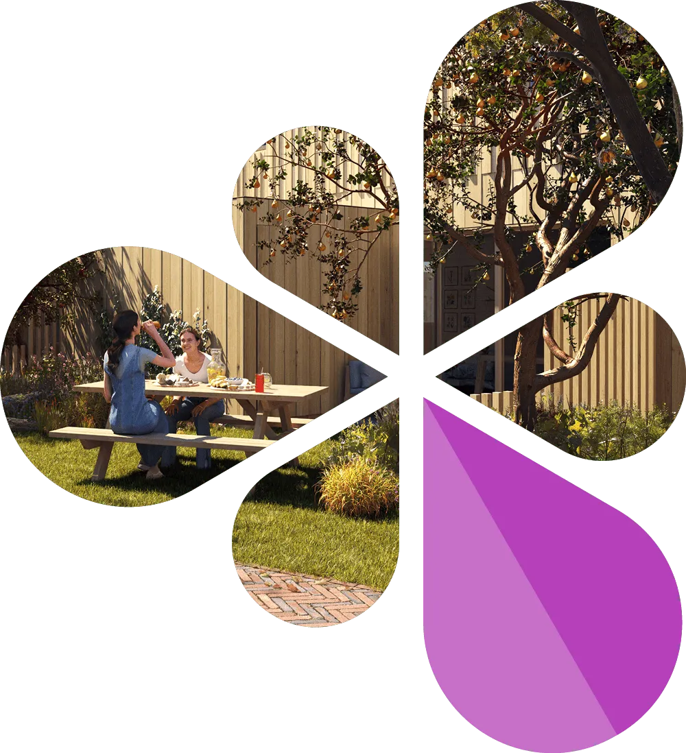 Two women sitting at a wooden picnic table in a sunlit garden with trees and green grass.