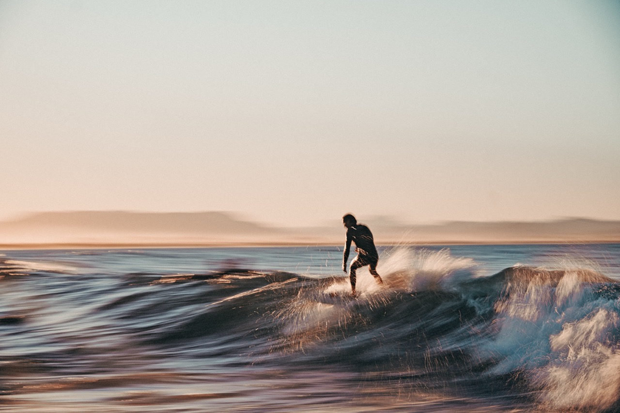 Surf photography capturing movement and presence in the ocean.
