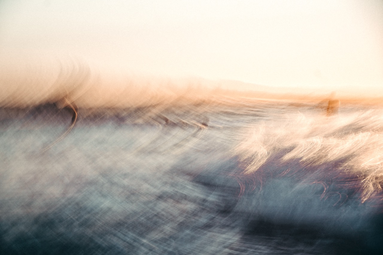 Abstract surf photography showing waves, light and horizon.