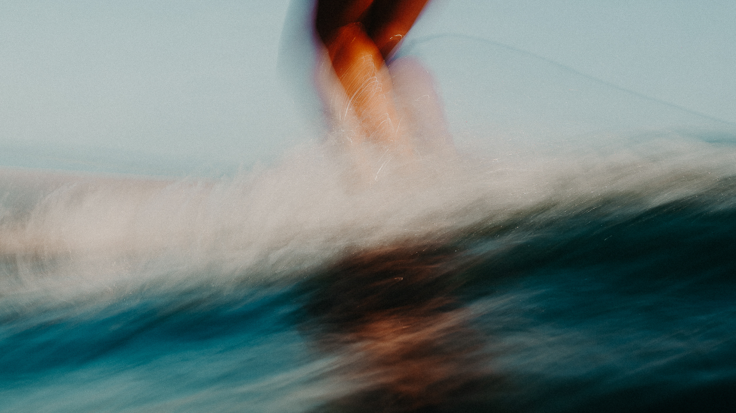 Surf photography capturing movement and presence in the ocean.