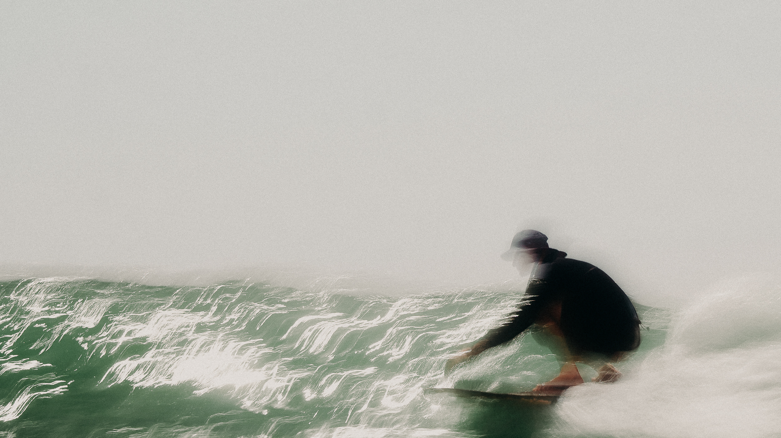 Fine art surf photography focusing on scale and atmosphere.