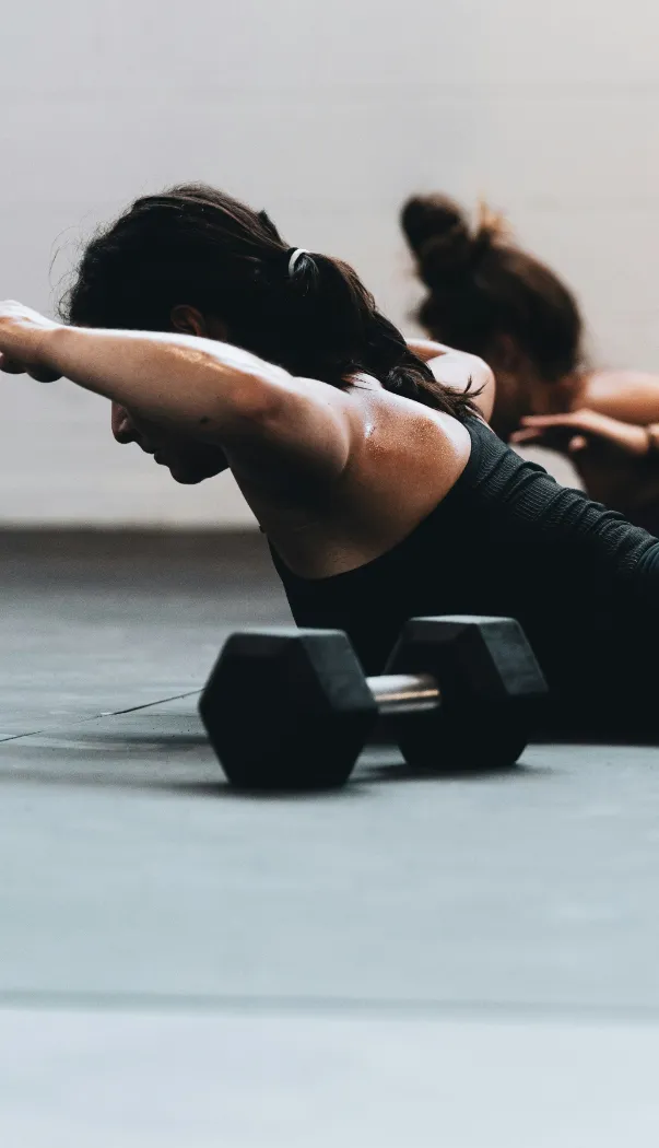 woman on floor lifting arms