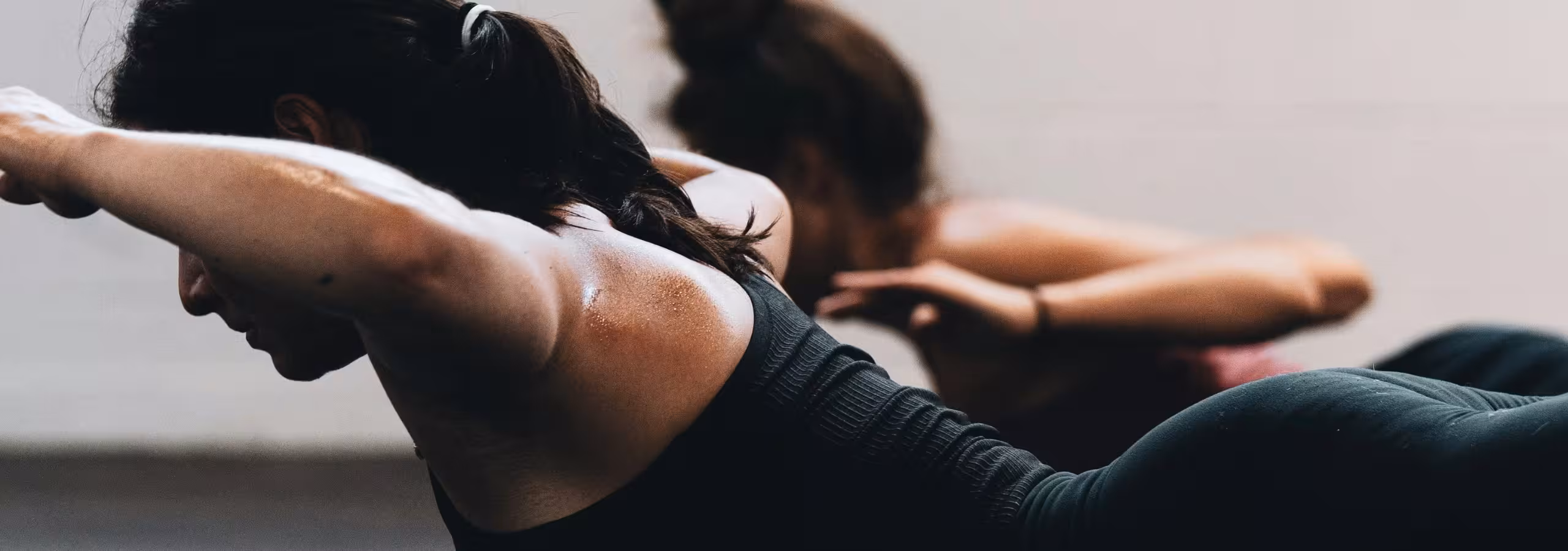 woman on floor lifting arms