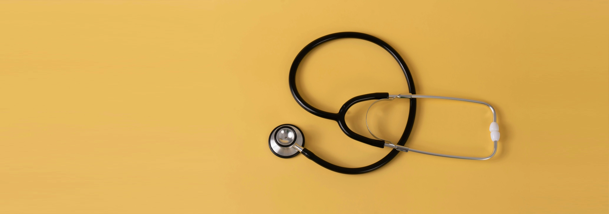 stethoscope on a yellow background