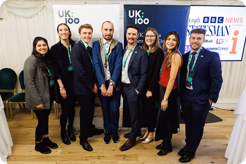 UK:100 group photo with diverse professionals in business attire