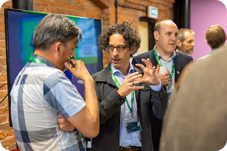 Professionals networking and discussing ideas at a conference or business event