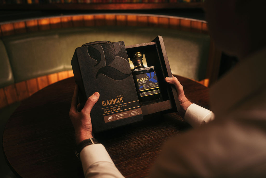 Hands opening the Bladnoch 30 Year Old presentation case