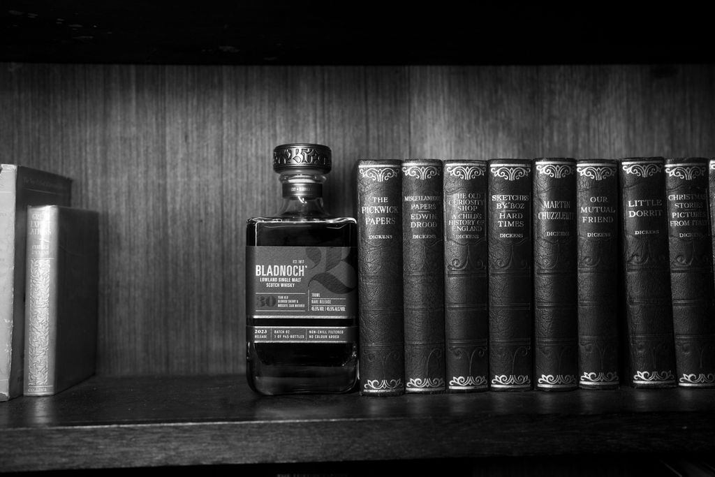 Bladnoch 30 Year Old shelved beside antique books