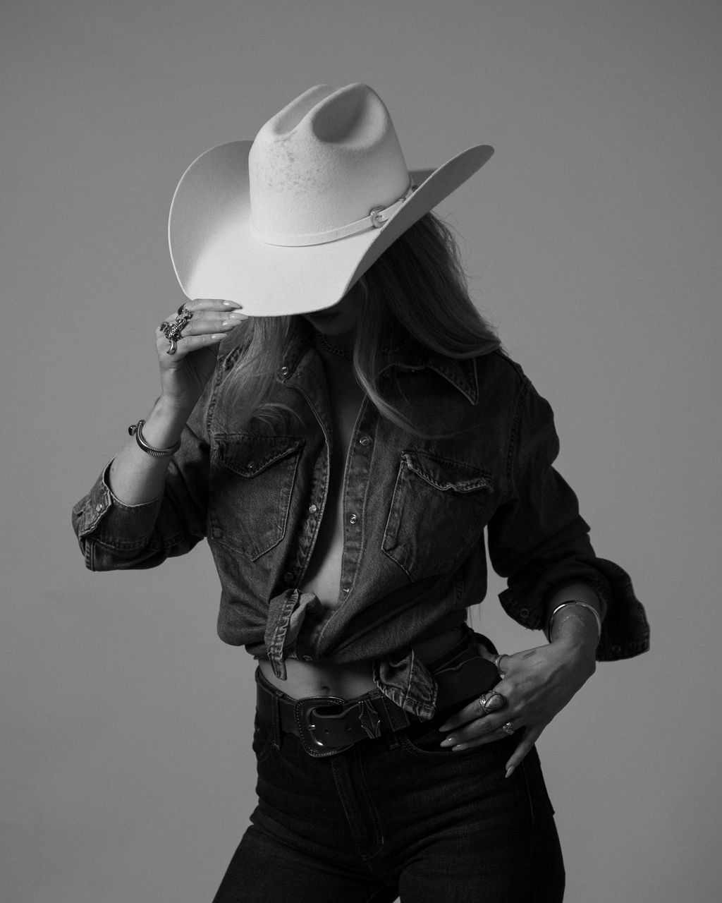 Cowboy Calling denim shirt and cream felt hat, studio portrait