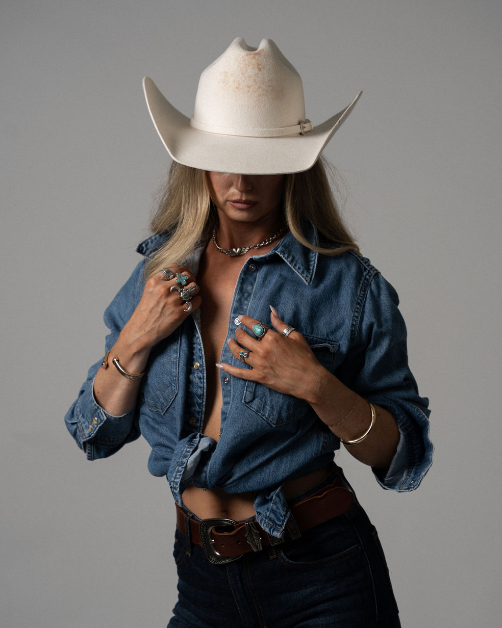 Ashleigh Greenwood in a cream cowboy hat and denim shirt