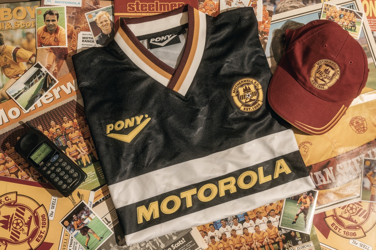 Motherwell away shirt, club cap and scarf laid out flat