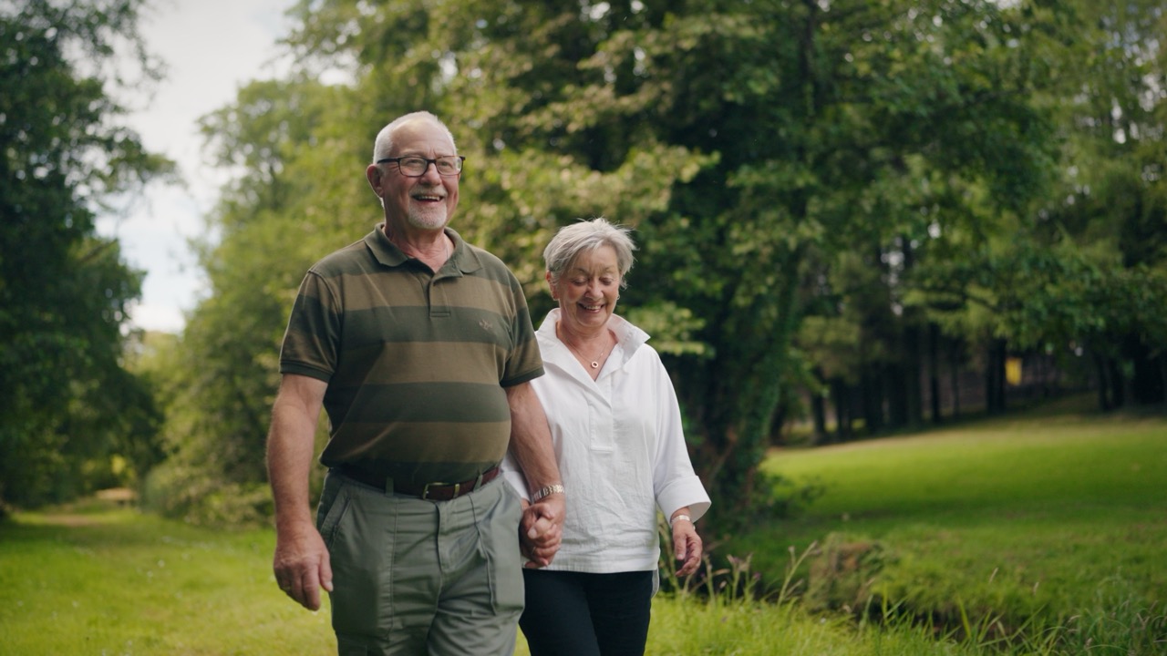 Roddy and Elaine standing near the bridge at Bladnoch, walking through the woods