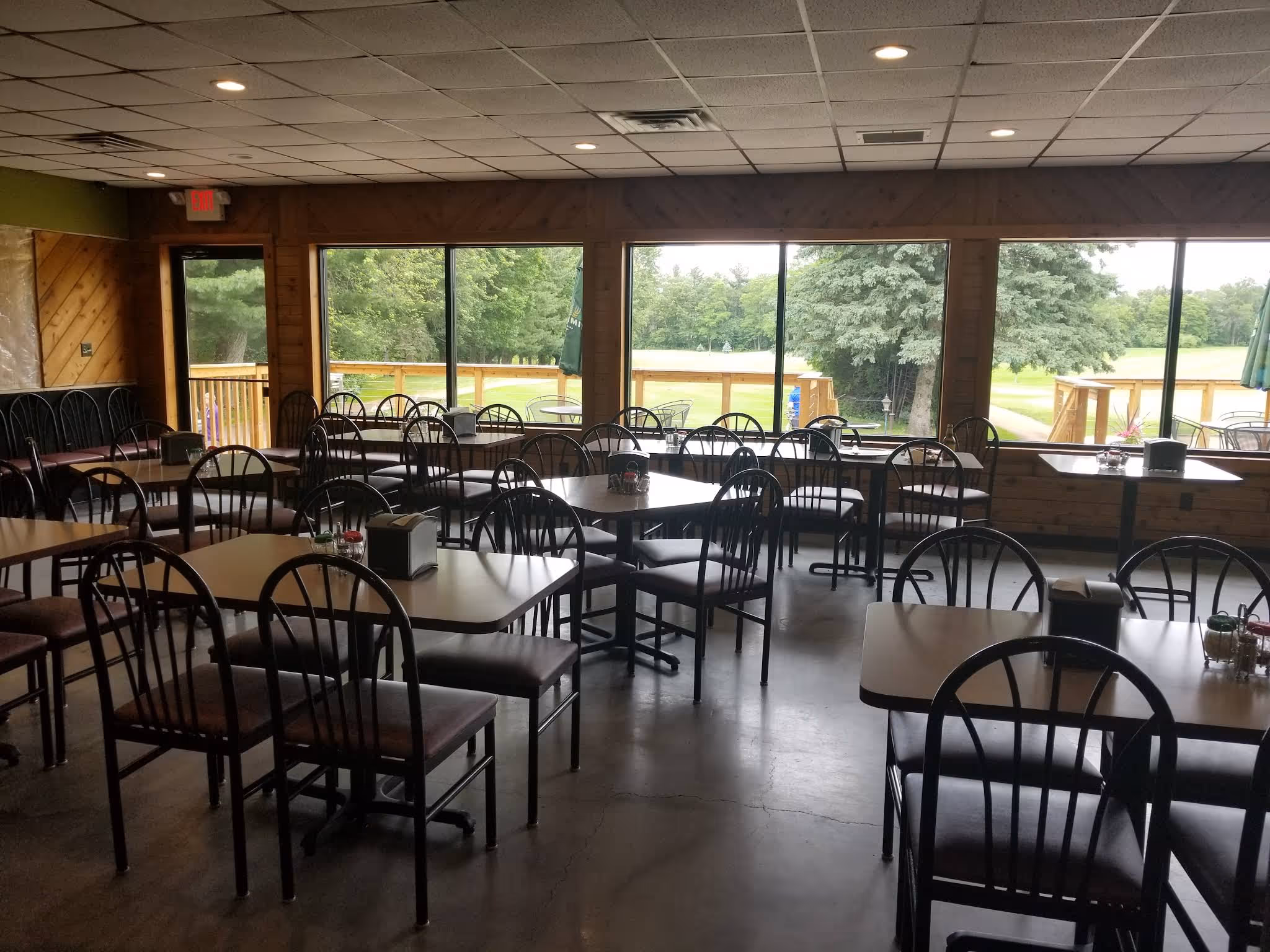 A restaurant with a view of the woods.